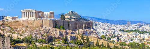 Panoramic view of Athens, Greece. Acropolis hill rises above cityscape. Landscape of old Athens city with Ancient Greek ruins. Skyline of Athens in summer.