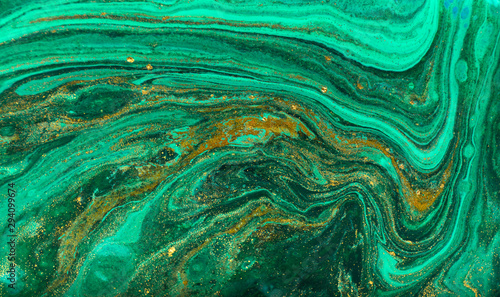 Green and gold ripple of agate background. Golden powder marble texture.