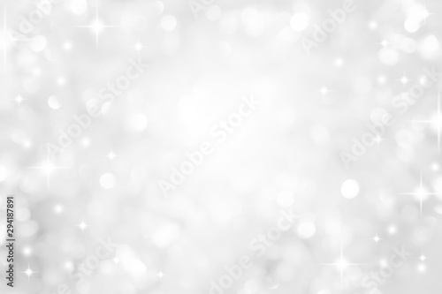 abstract blur white and silver color background with star glittering light for show,promote and advertisee product and content in merry christmas and happy new year season collection concept 