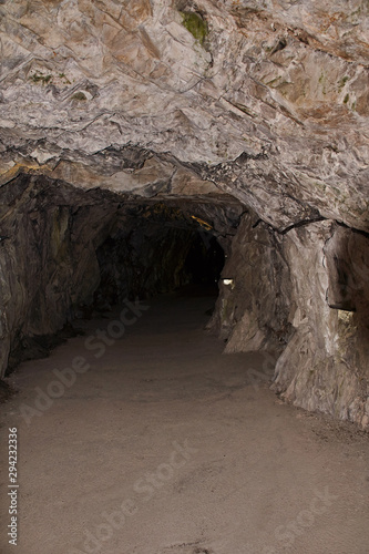 Underground Grotto Panorama.Types of a former underground marble quarry flooded with water. The massive arches of the grotto and the texture of natural marble are visible. Russia, Karelia, Ruskeala