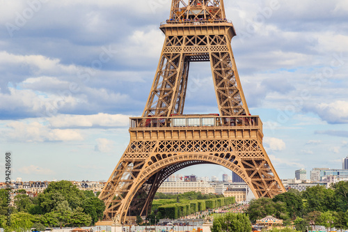 Shot of the Eiffel Tower in Paris France on a beautiful Spring day with blue sky and white clouds