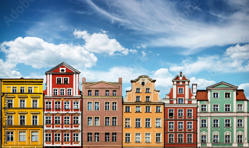 Colorful facades of historic buildings against the sky in the historic old town of Wroclaw, Poland. Architecture and historic background.