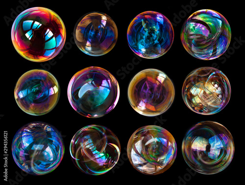 Group of soap bubbles isolated on black background.