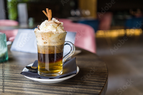 Close up of cup of irish coffee with cream at restaurant