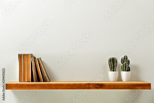 Wooden kitchen shelf of free space for your decoration and gray wall space 