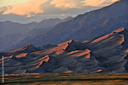 Low angle late afternoon light illuminates dunes and casts shadows, Great Sand Dunes National Park and Preserve, Colorado