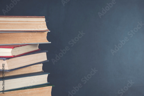 books on chalkboard background