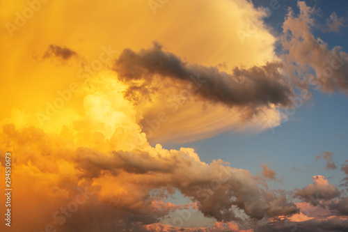 Clouds and sky at sunrise and sunset, orange and red colors.