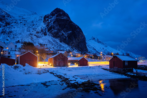 Ramberg village with red traditional rorbue houses in the night, Norway