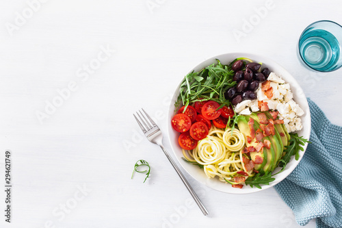 ketogenic lunch bowl: spiralized courgette with avocado, tomato, feta cheese, olives, bacon