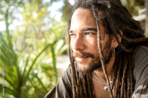 handsome guy with dreadlocks on an island in thailand