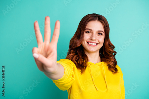 Photo of wavy curly charming fascinating gorgeous girlfriend smiling toothily showing you three fingers sign isolated over turquoise vivid color background