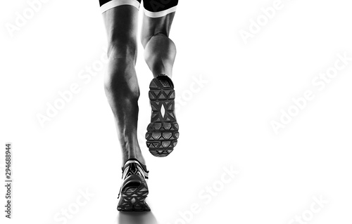 Sports background. Runner feet running closeup on shoe. Isolated on white.