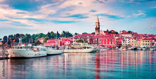 Panoramic evening cityscape of old fishing town Isola. Colorful summer seascape of Adriatic Sea. Beautiful outdoor scene of Slovenia, Europe. Traveling concept background.