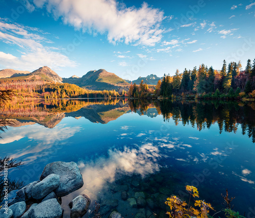 Wonderful autumn view of Strbske pleso lake. Romantic morning scene of High Tatras National Park, Slovakia, Europe. Beauty of nature concept background.