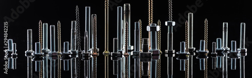 panoramic shot of diverse spotless metallic screws isolated on black