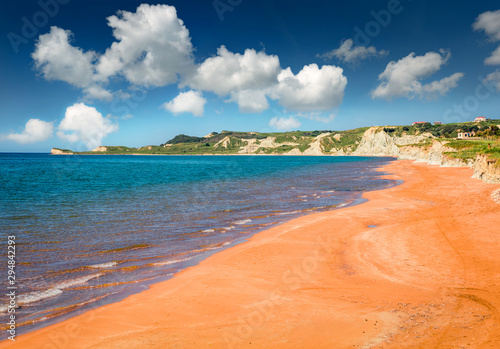 Stunning summer view of famous Xi Beach. Sunny morning scene of Cephalonia island, Greece, Europe. Attractive seascape of Ionian Sea. Traveling concept background.