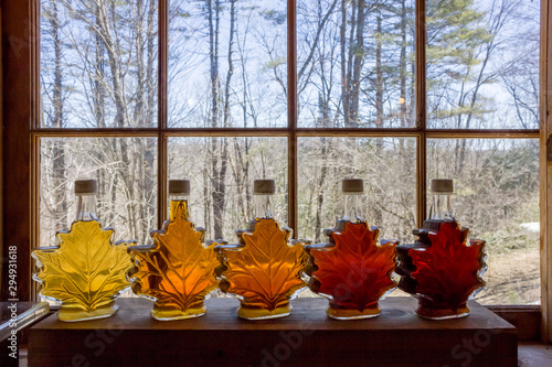 Various Grades Of Delicious Vermont Maple Syrup Lined Up On A Windowsill