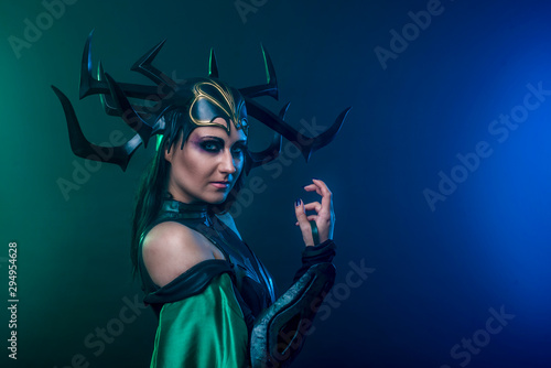 beautiful woman in halloween cosplay costume. goddess of death 