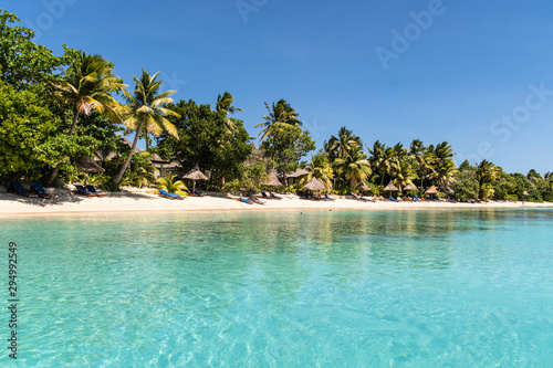 Idyllic turquoise water by an exotic beach in the Yasawa island in Fiji in the south Pacific ocean