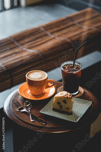 cup of coffee and cake on table