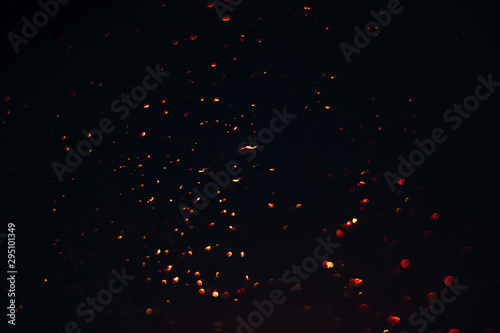 golden bokeh on a black background, garland lights blurred festive abstract backdrop