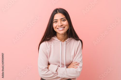 Young pretty arab woman wearing a casual sport look laughing and having fun.