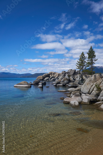 Two lone Pine trees growing on a rocky outcrop on Lake Tahoe