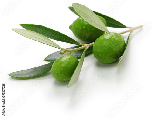 green olives with leaves isolated on white background