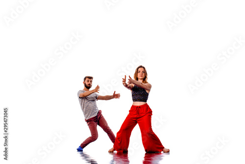 Stunning couple dancing in studio, portrait