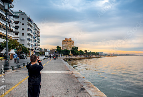 View of famous white tower and buildings of leoforos Nikis at seafront. Thessaloniki, Greece .