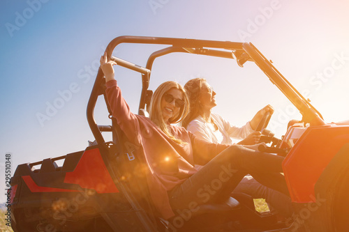 two young women driving a off road buggy car