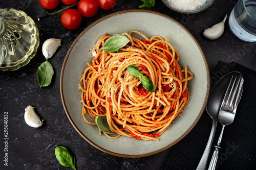 Close up of spaghetti with tomato sauce on black background