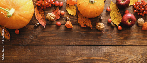 thanksgiving day concept. autumn still life with pumpkins and leaves on wooden background
