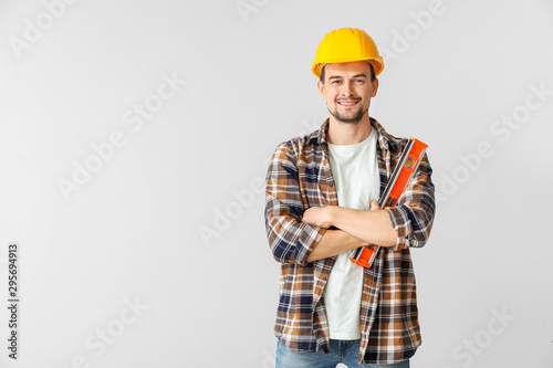 Portrait of male architect on light background