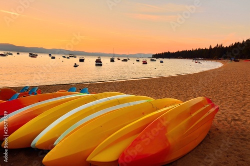 colorful kayaks resting on the beach