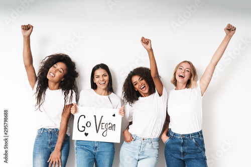 Friends posing isolated holding blank with motivation vegan text.