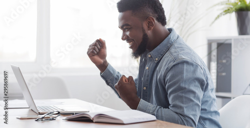 Happy African American Freelancer Celebrating Successful Online Interview