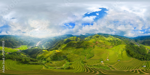 360 panorama by 180 degrees angle seamless panorama view of paddy rice terraces, green agricultural fields in rural area of Mu Cang Chai, mountain hills valley in Vietnam. Nature landscape background.