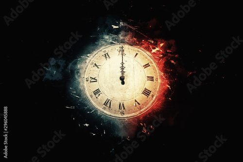 old clock on black background at midnight or midday