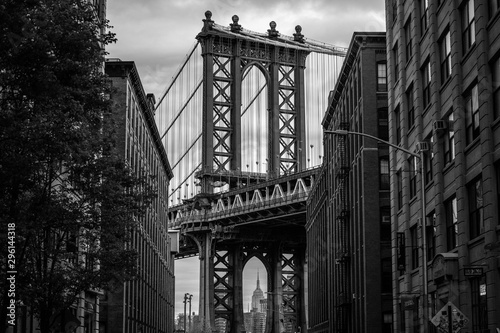 View of one of the towers of the Manhattan Bridge from the streets of the DUMBO district, Brooklyn, NYC black and white