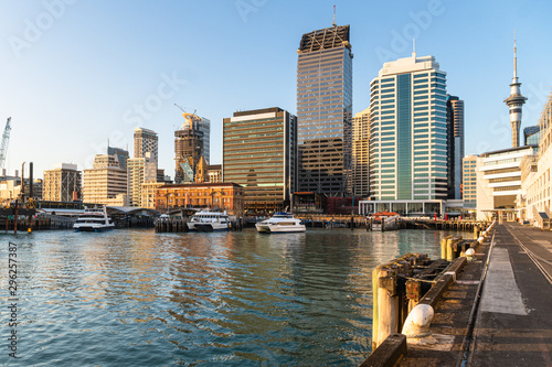 Auckland business district skyline by the waterfront with the ferry terminal building in New Zealand largest city in the early morning