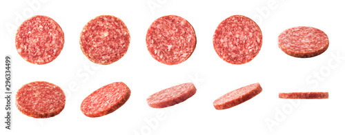 Top and side views of smoked salami sausage slices isolated on white background