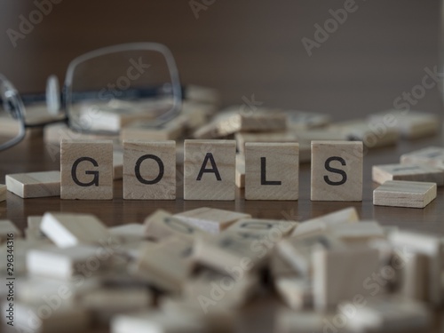 The concept of Goals represented by wooden letter tiles