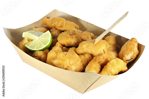 Kibbeling in a cardboard tray isolated on white background. Kibbeling is a Dutch snack consisting of battered chunks of fish. It is a very popular dish in the Netherlands.