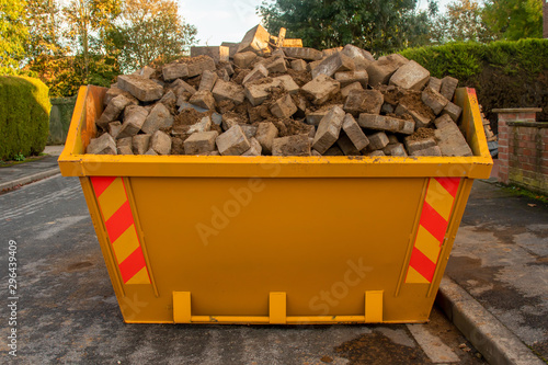 Domestic skip full of rubble