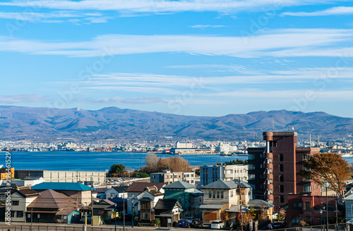 Hakodate harbour bay and cityscape with mountain view and blue sky