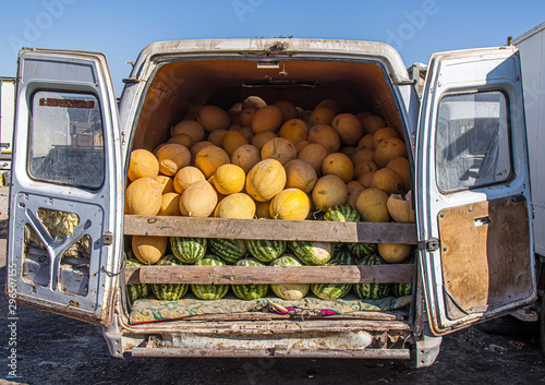 Melons and watermelons in a car market