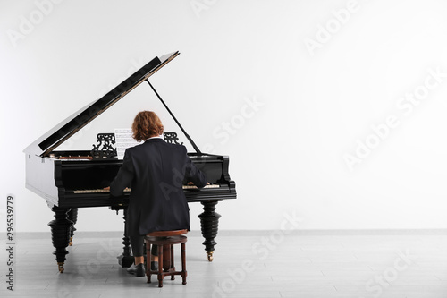 Man playing grand piano at the concert