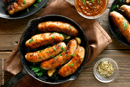 Fried sausages in frying pan